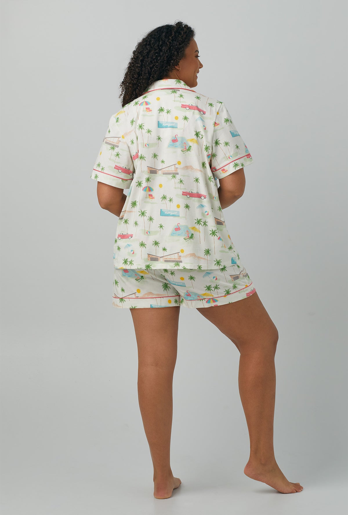 A lady wearing plus size white Short Sleeve Classic Shorty Stretch Jersey PJ Set with Welcome To Palm Springs print