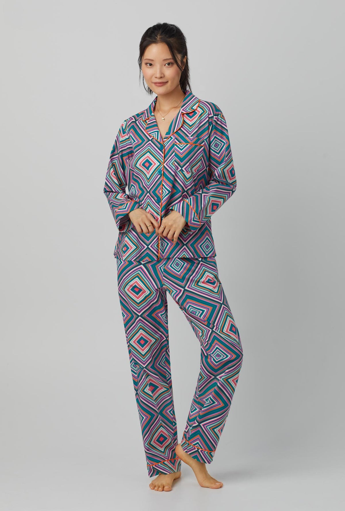 A lady wearing Long Sleeve Classic Woven Cotton Poplin PJ Set with diamond geo print