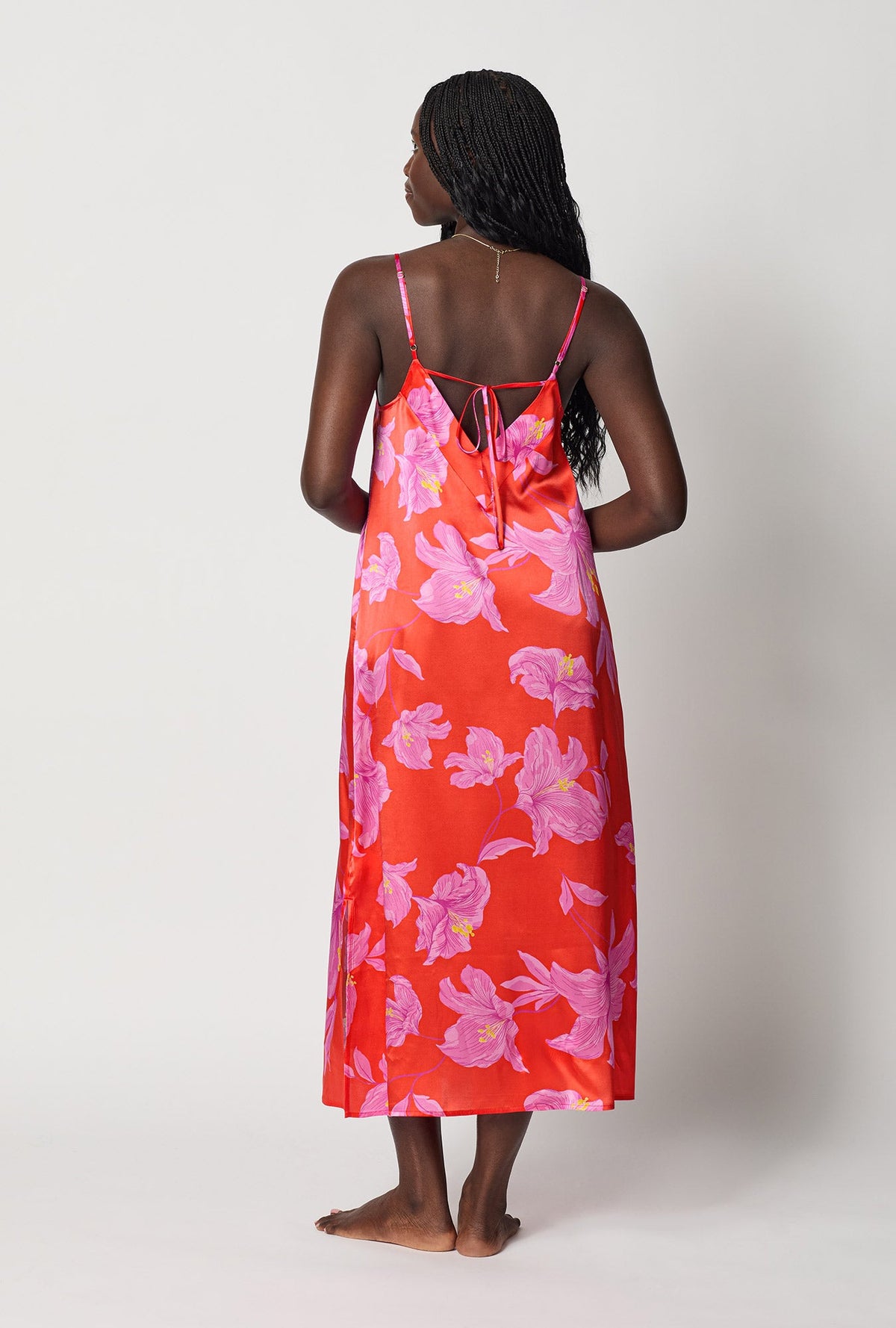 A lady wearing Red Woven Washable Silk Chemise back view