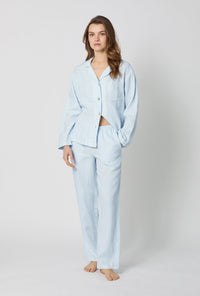 A lady wearing Baby's Breath Blue Long Sleeve Classic Woven Linen Pj Set front view