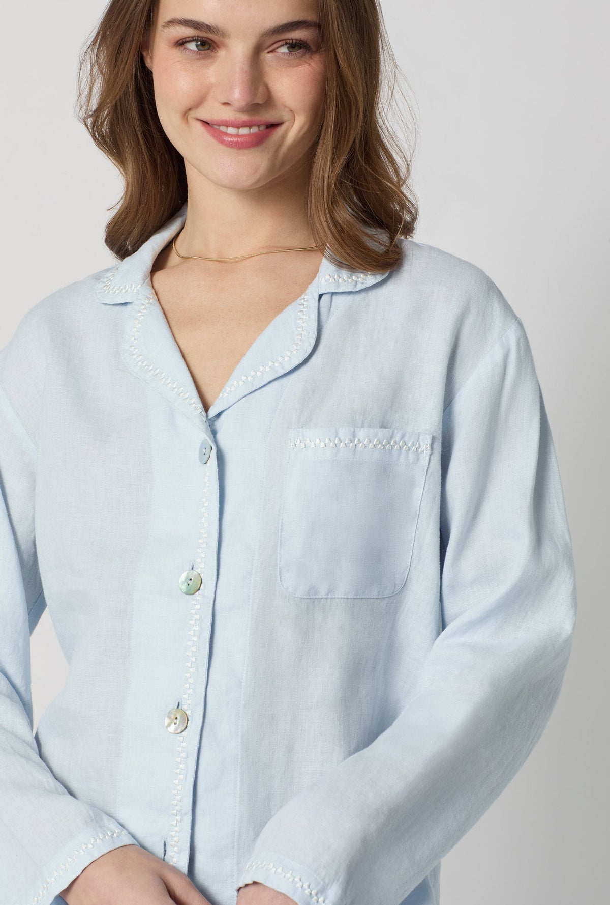 A closeup of A lady wearing Baby's Breath Blue Long Sleeve Classic Woven Linen Pj Set