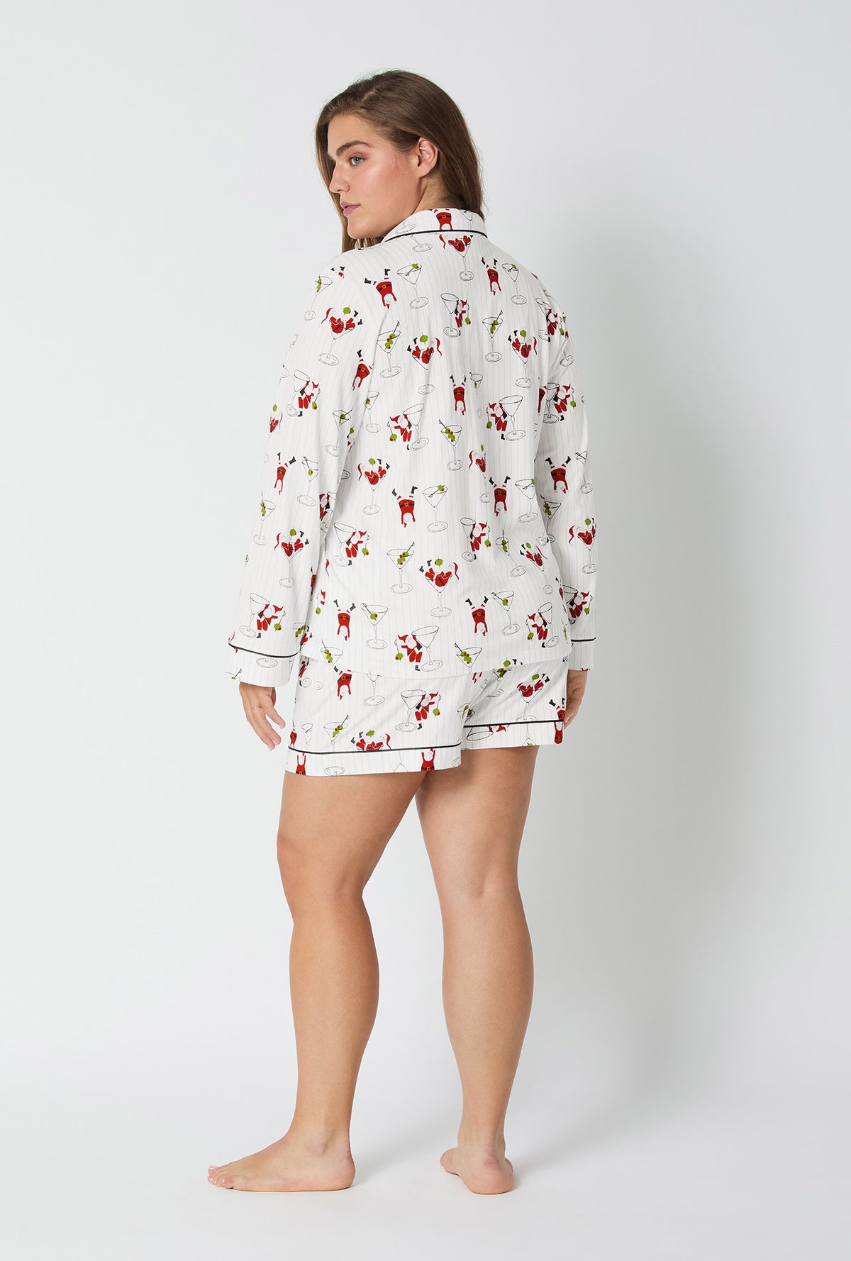 A lady wearing Tipsy Santa Long Sleeve Classic Stretch Jersey Shorty Pj Set
