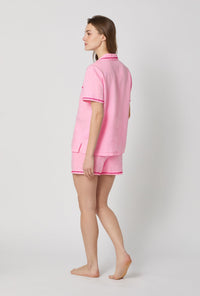 A lady wearing Pink Short Sleeve Classic Shorty Woven Linen Pj Set back view