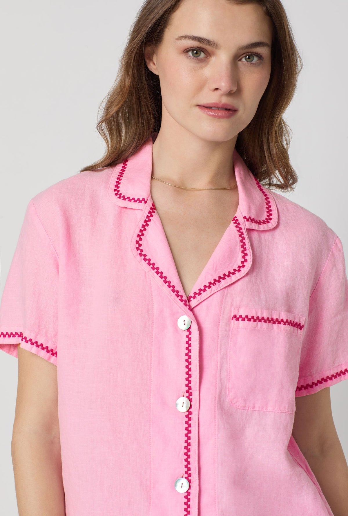 A closeup of A lady wearing Pink Short Sleeve Classic Shorty Woven Linen Pj Set