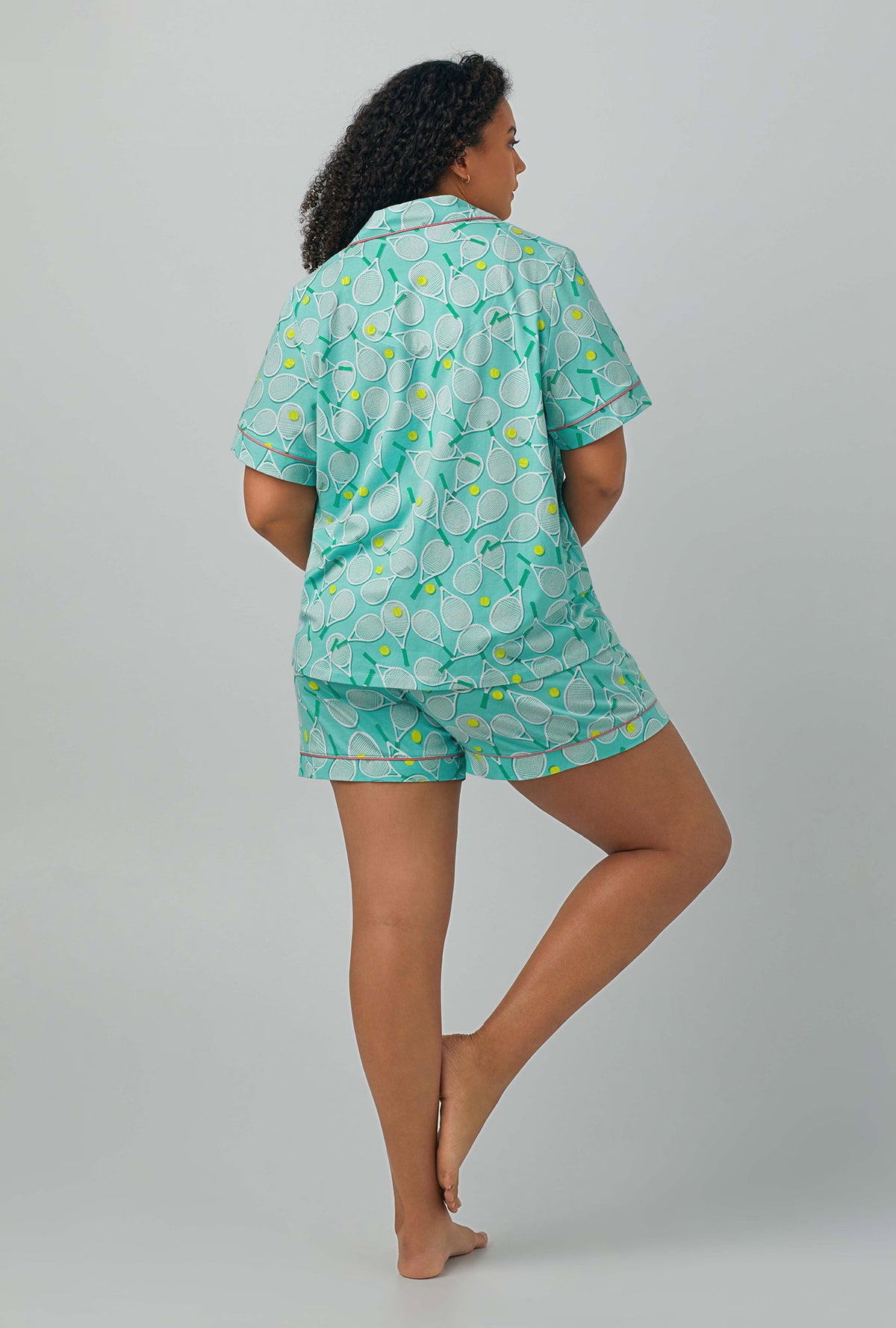 A lady wearing plus size green Short Sleeve Classic Shorty Stretch Jersey PJ Set with Tennis Club print