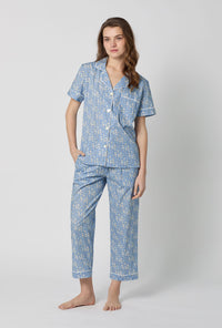 A lady wearing Blue Short Sleeve Classic Woven Tana Lawn® Cropped Pj Set Made With Liberty Fabric front view