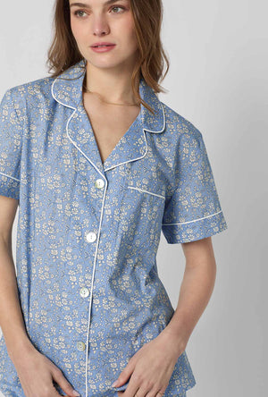 A closeup of A lady wearing Blue Short Sleeve Classic Woven Tana Lawn® Cropped Pj Set Made With Liberty Fabric