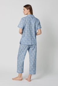 A lady wearing Blue Short Sleeve Classic Woven Tana Lawn® Cropped Pj Set Made With Liberty Fabric back view