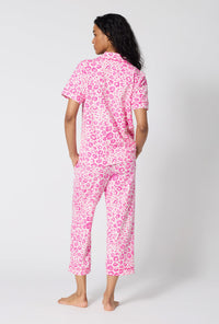 A Lady Wearing Valentina Leopard Short Sleeve Classic Stretch Jersey Cropped Pj Set in a back view pose