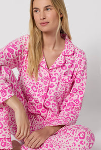 A Lady Wearing Valentina Leopard Long Sleeve Classic Stretch Jersey Pj Set in a close up view sitting pose