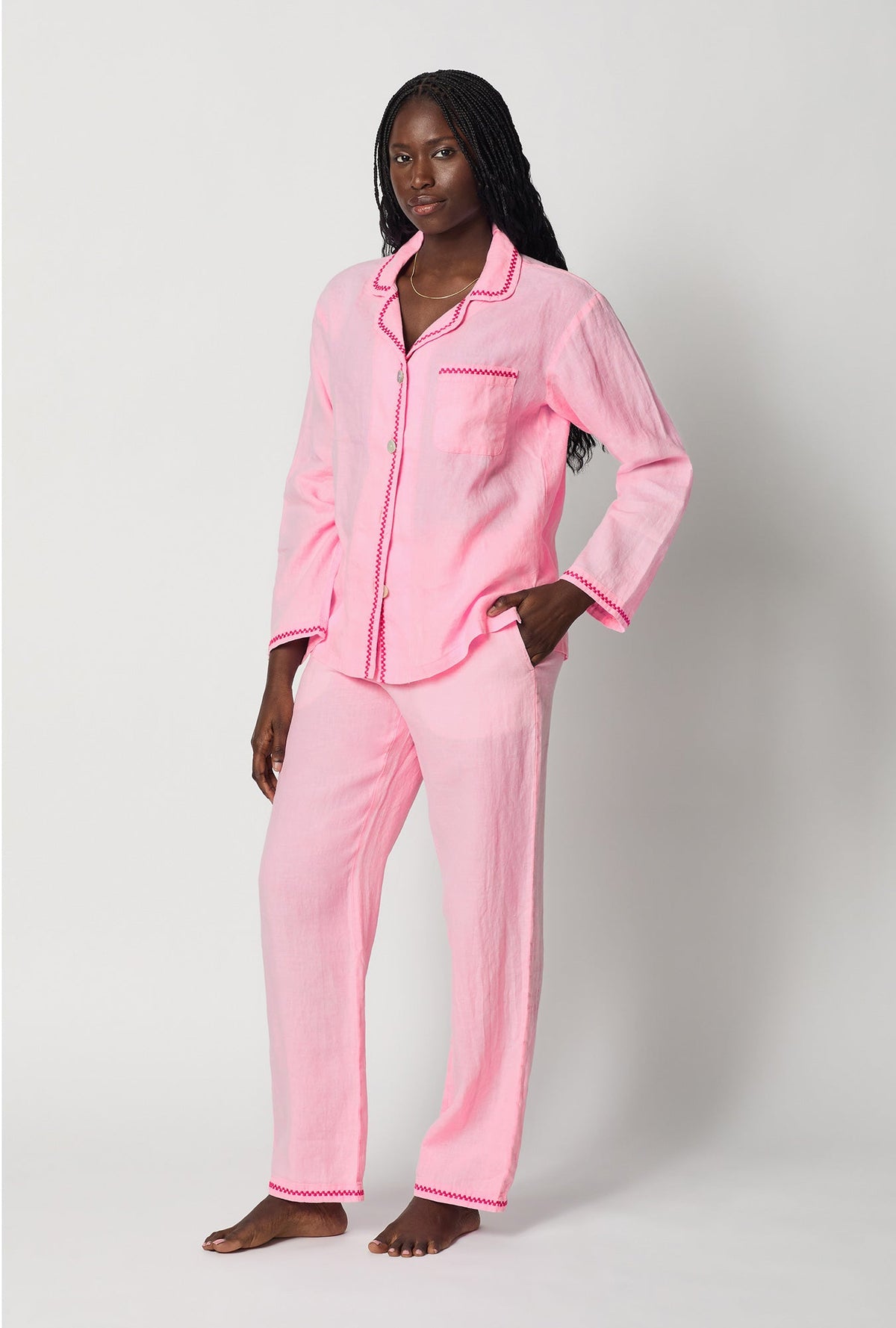 A lady wearing Pink Long Sleeve Classic Woven Linen Pj Set side view