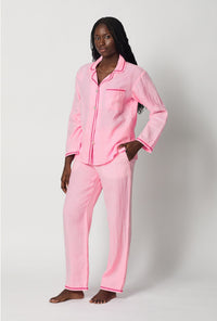 A lady wearing Pink Long Sleeve Classic Woven Linen Pj Set side view