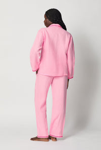 A lady wearing Pink Long Sleeve Classic Woven Linen Pj Set back view