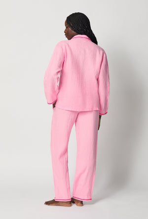 A lady wearing Pink Long Sleeve Classic Woven Linen Pj Set back view