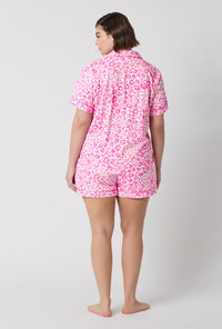 A Lady Wearing Plus Size Valentina Leopard Short Sleeve Classic Shorty Stretch Jersey Pj Set in a back view pose