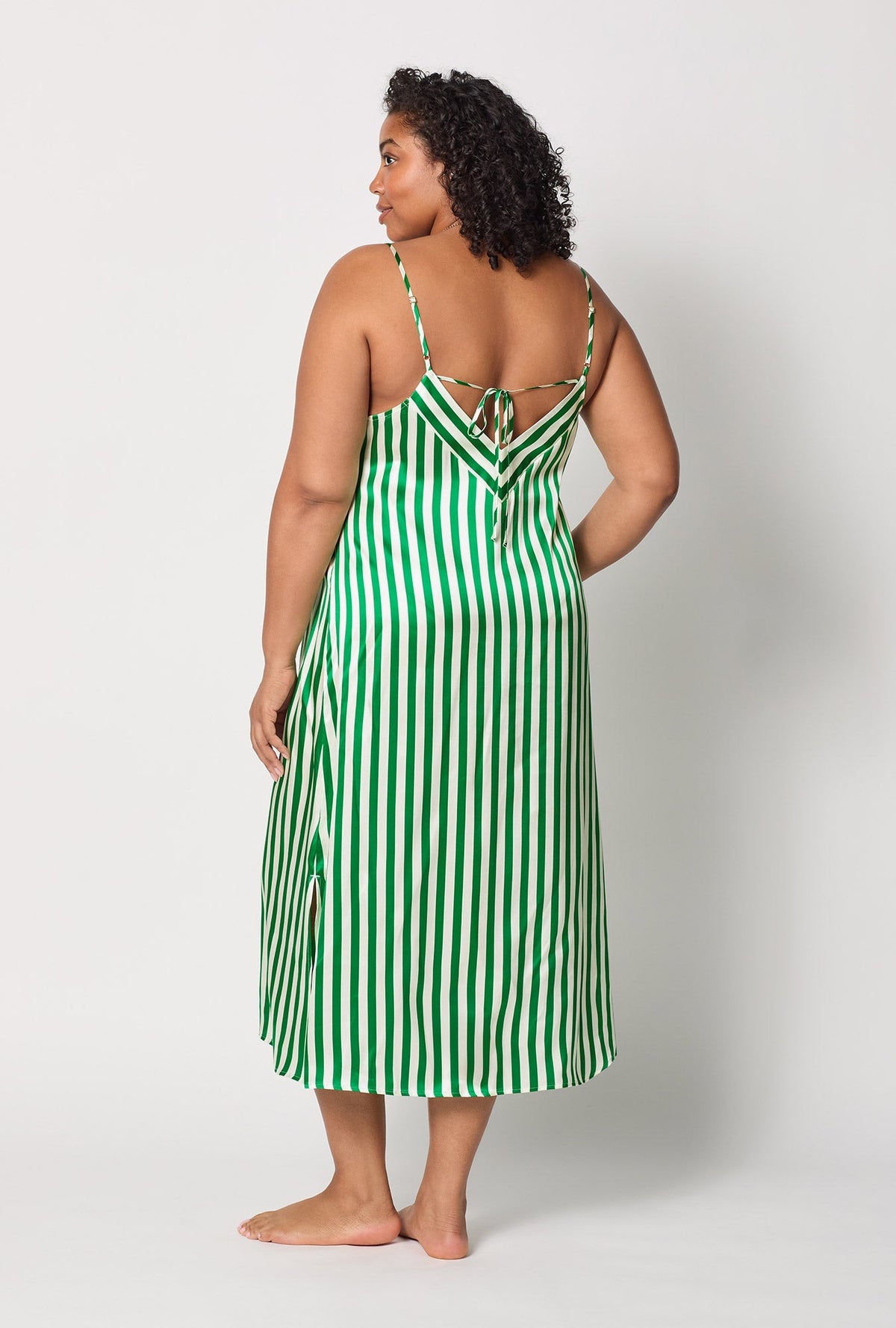 A lady wearing plus size Green and  White Woven Washable Silk Chemise back view