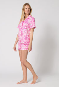 A Lady Wearing Valentina Leopard Short Sleeve Classic Shorty Stretch Jersey Pj Set in a side angle pose
