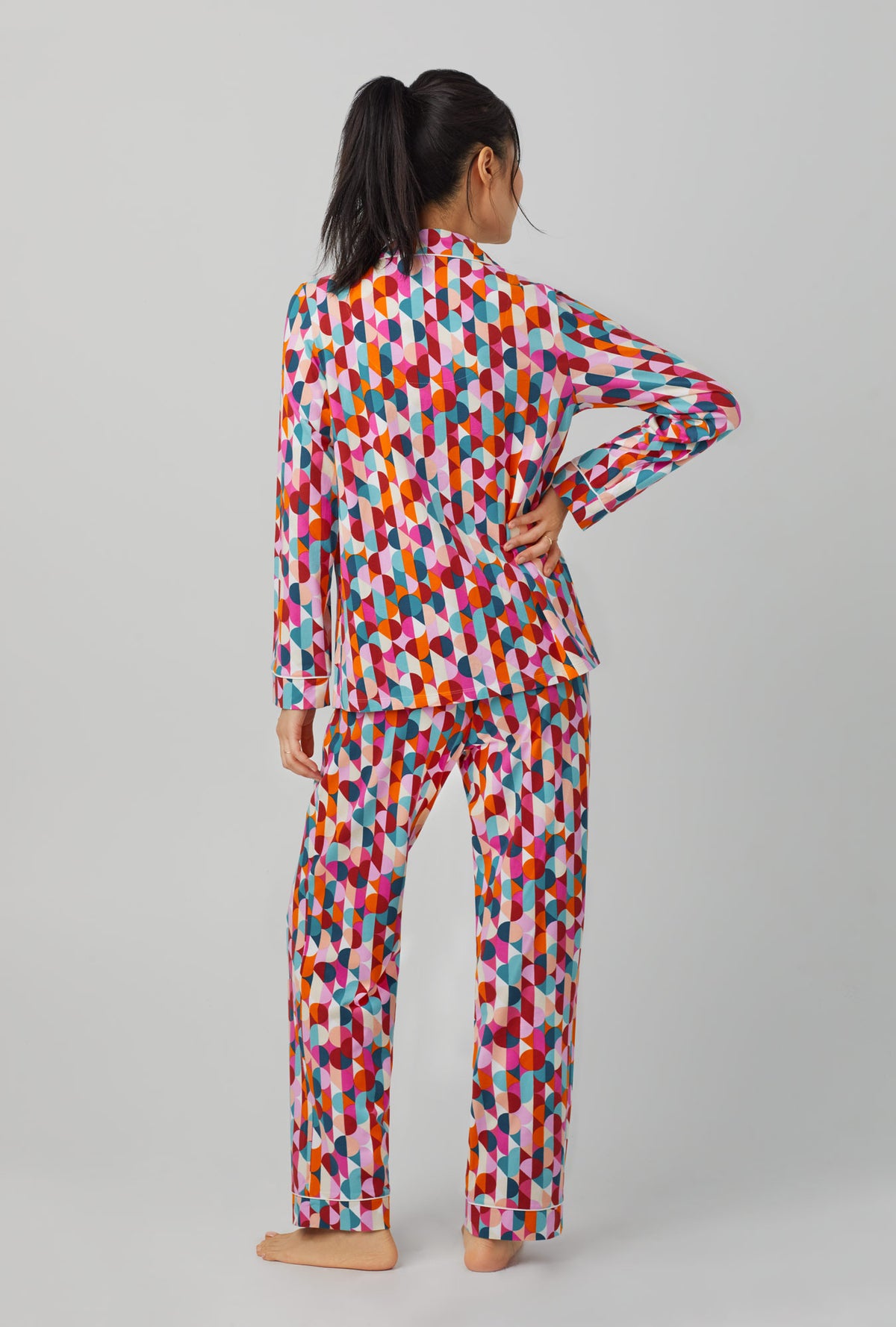 A lady wearing Long Sleeve Classic Stretch Jersey PJ Set with dancing dots print
