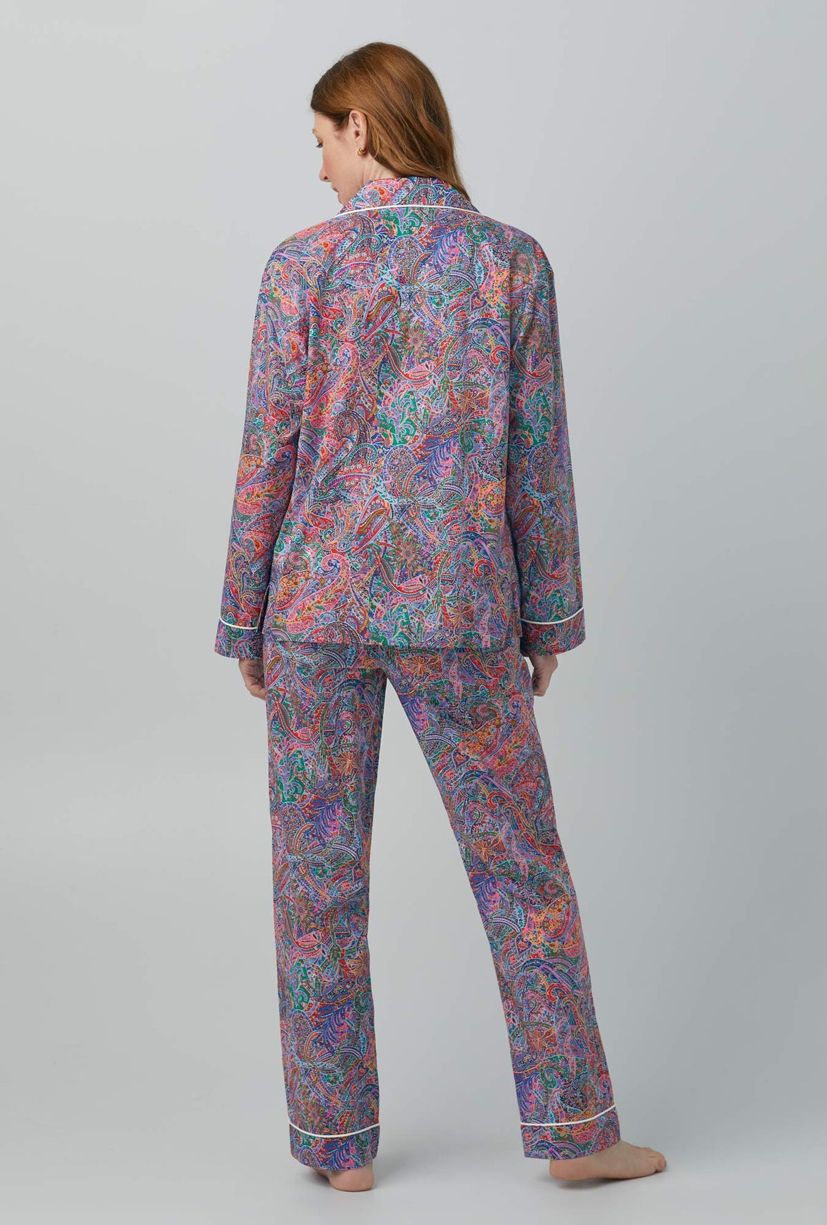 A lady wearing Dana Sharmin Long Sleeve Classic Woven Cotton Tana Lawn® PJ Set Made with Liberty Fabrics