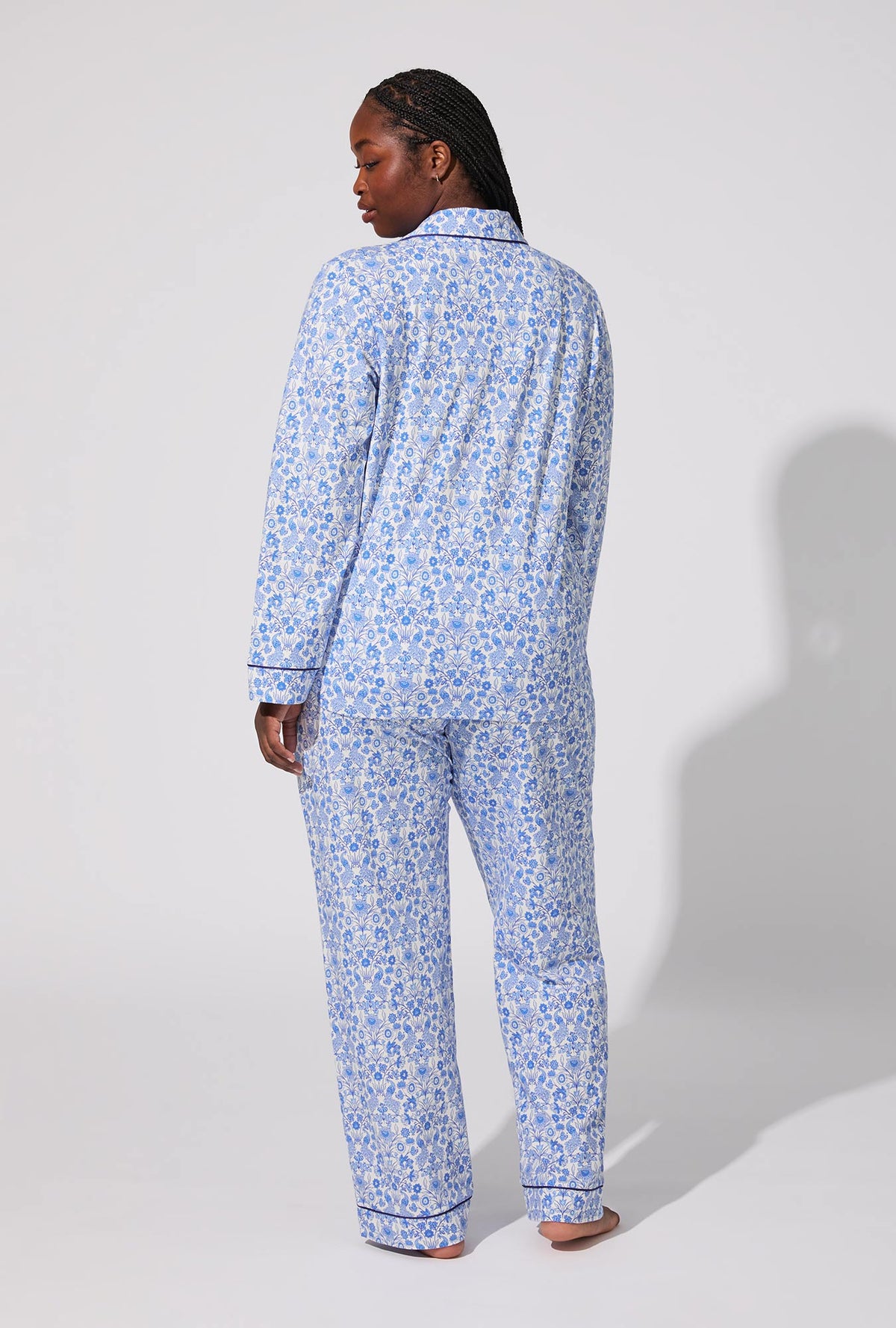 A lady wearing Bloomscape White Long Sleeve Classic Stretch Jersey PJ Set