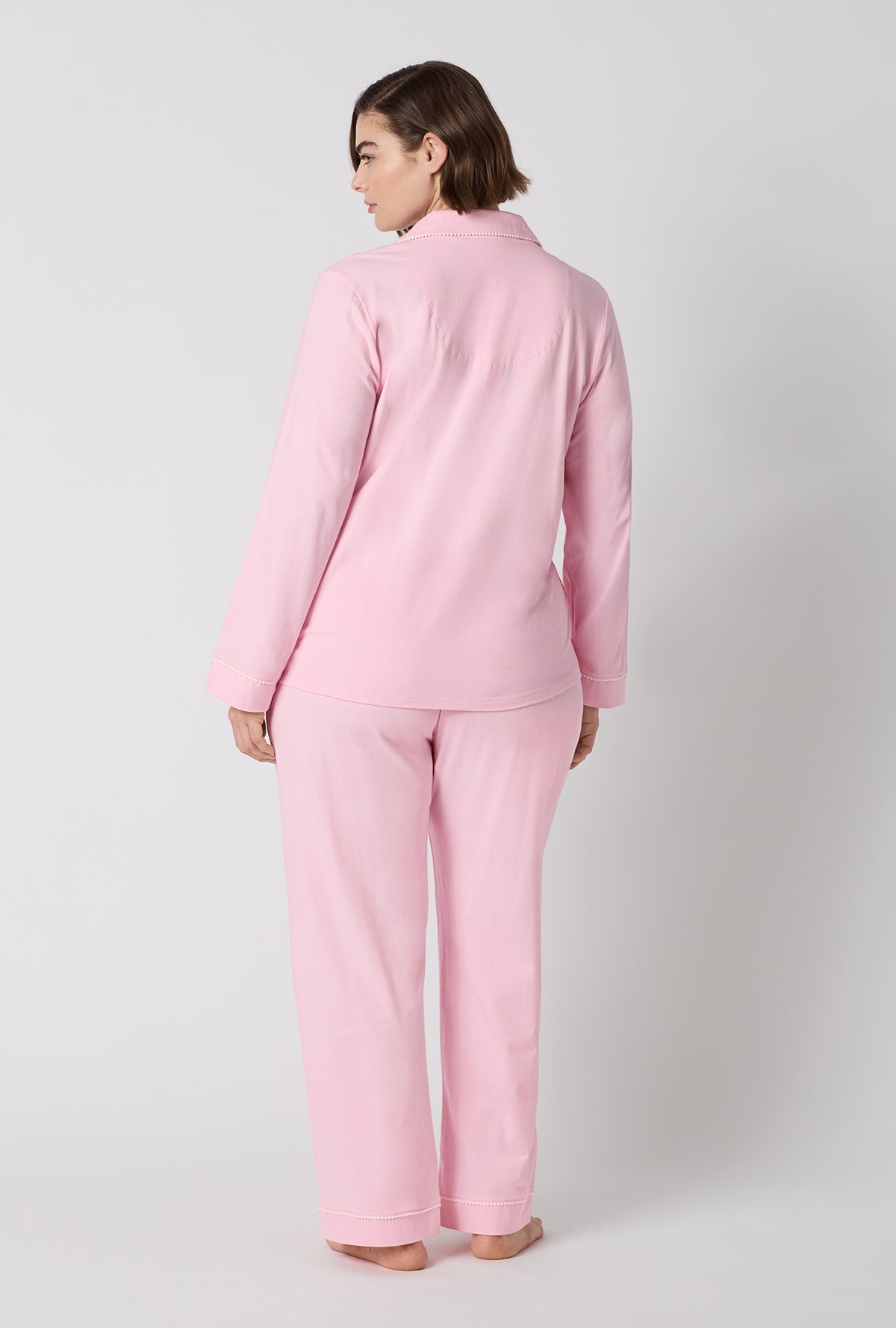 A lady wearing plus size Pink Powder Long Sleeve Classic Stretch Jersey Pj Set back view