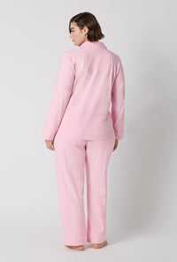 A lady wearing plus size Pink Powder Long Sleeve Classic Stretch Jersey Pj Set back view