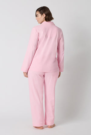 A lady wearing plus size Pink Powder Long Sleeve Classic Stretch Jersey Pj Set back view