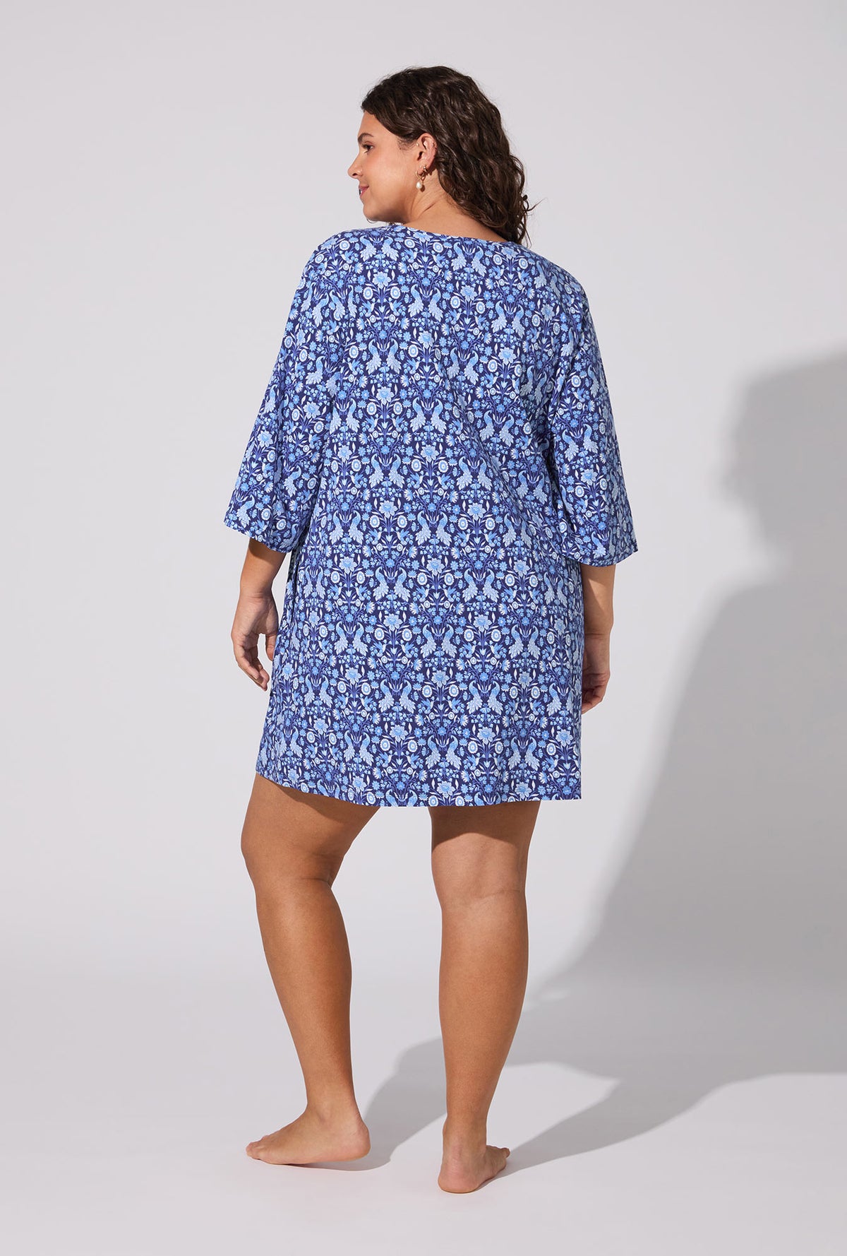 A lady wearing Bloomscape Blue V-neck Stretch Jersey Sleep Dress