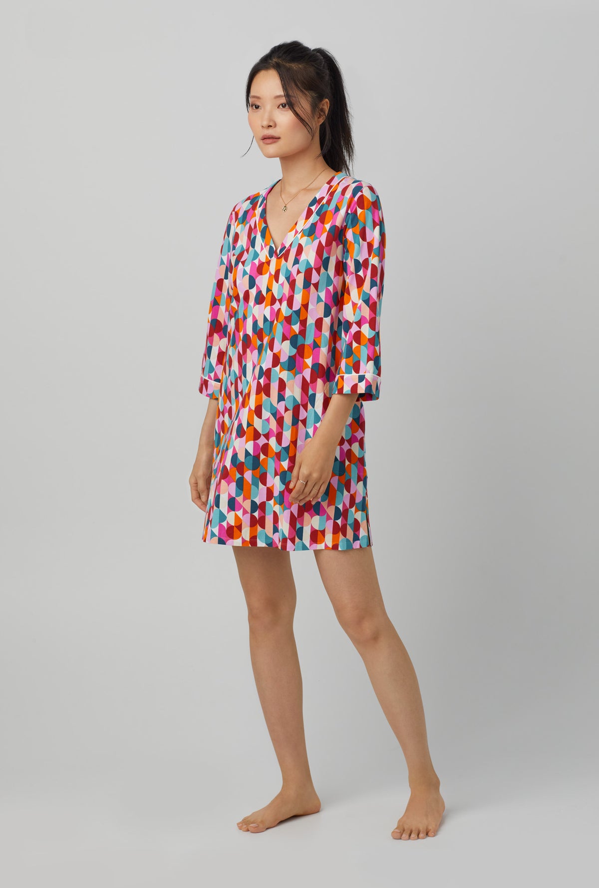 A lady wearing 3/4 Sleeve Stretch Jersey Sleepshirt with dancing dots print