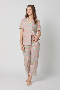 A lady wearing Emma & Georgina Short Sleeve Classic Woven Tana Lawn® Cropped Pj Set Made With Liberty Fabric side view