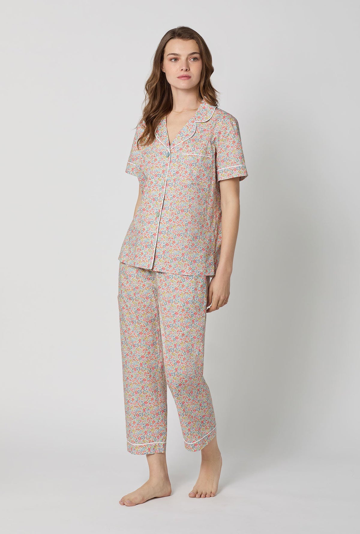 A lady wearing Emma & Georgina Short Sleeve Classic Woven Tana Lawn® Cropped Pj Set Made With Liberty Fabric side view