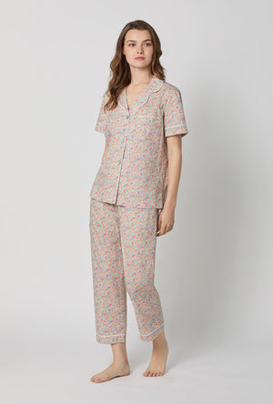 A lady wearing Emma & Georgina Short Sleeve Classic Woven Tana Lawn® Cropped Pj Set Made With Liberty Fabric side view
