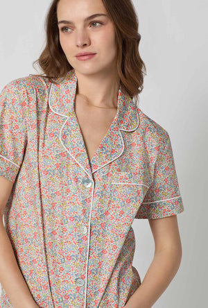 A closeup of A lady wearing Emma & Georgina Short Sleeve Classic Woven Tana Lawn® Cropped Pj Set Made With Liberty Fabric