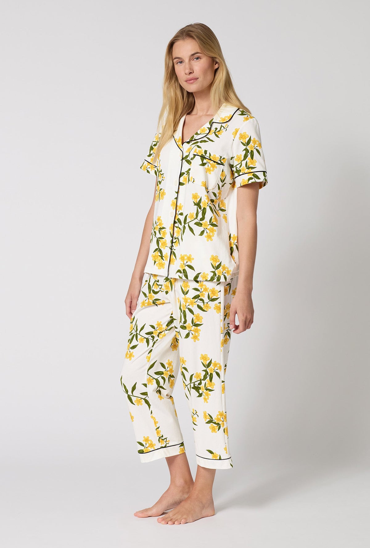 A Lady Wearing  Carolina Jasmine Short Sleeve Classic Stretch Jersey Cropped Pj Set in a side angled pose
