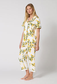 A Lady Wearing  Carolina Jasmine Short Sleeve Classic Stretch Jersey Cropped Pj Set in a side angled pose