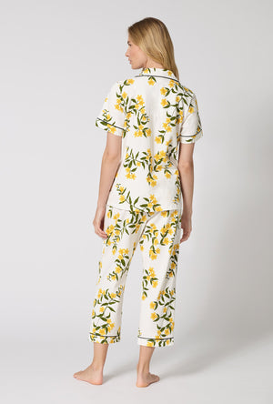 A Lady Wearing  Carolina Jasmine Short Sleeve Classic Stretch Jersey Cropped Pj Set in a back view pose
