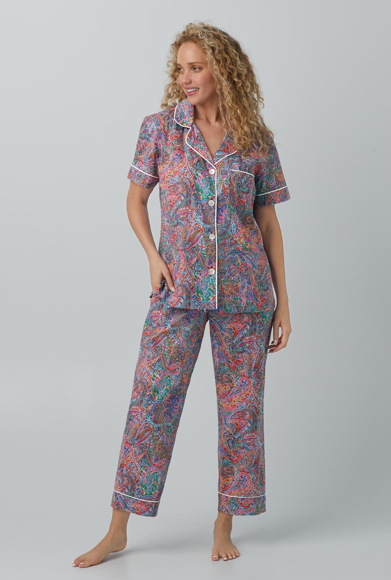 A lady wearing Dana Sharmin Short Sleeve Classic Woven Cotton Tana Lawn® Cropped PJ Set Made with Liberty Fabrics