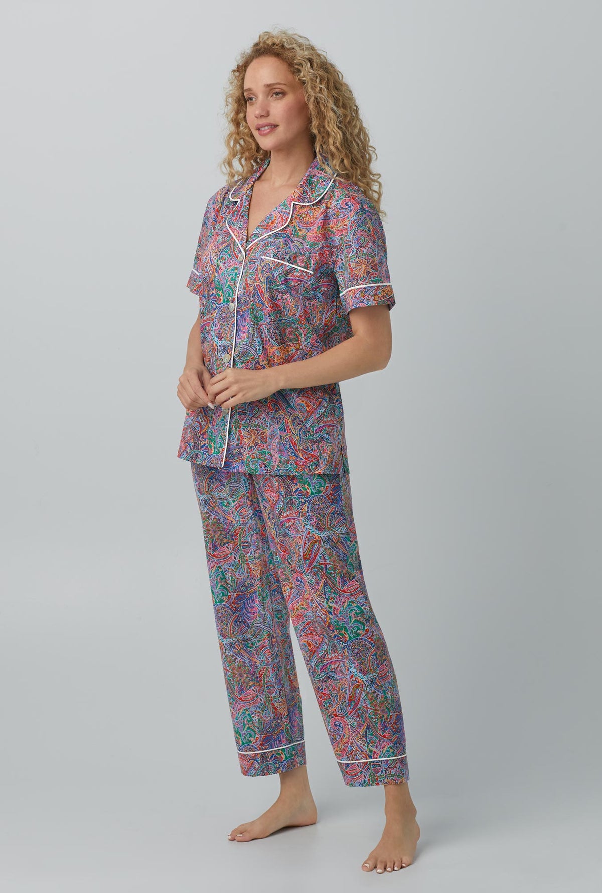 A lady wearing Dana Sharmin Short Sleeve Classic Woven Cotton Tana Lawn® Cropped PJ Set Made with Liberty Fabrics
