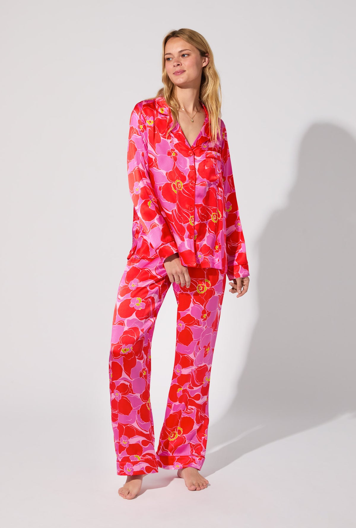 A lady wearing BedHead X Trina Turk Winter Orchids Long Sleeve Classic Washable Silk PJ Set
