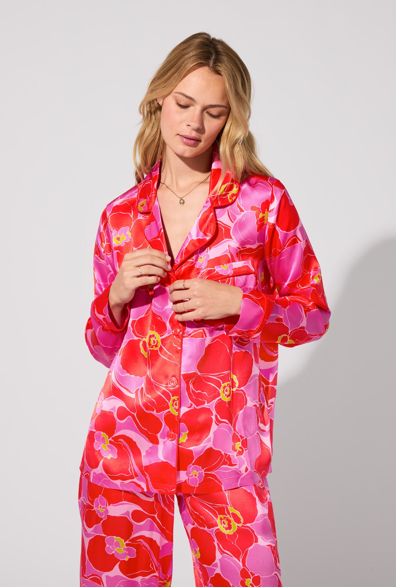 A lady wearing BedHead X Trina Turk Winter Orchids Long Sleeve Classic Washable Silk PJ Set