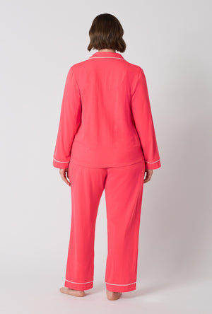 A lady wearing plus size Coral Red Long Sleeve Classic Stretch Jersey Pj Set back view