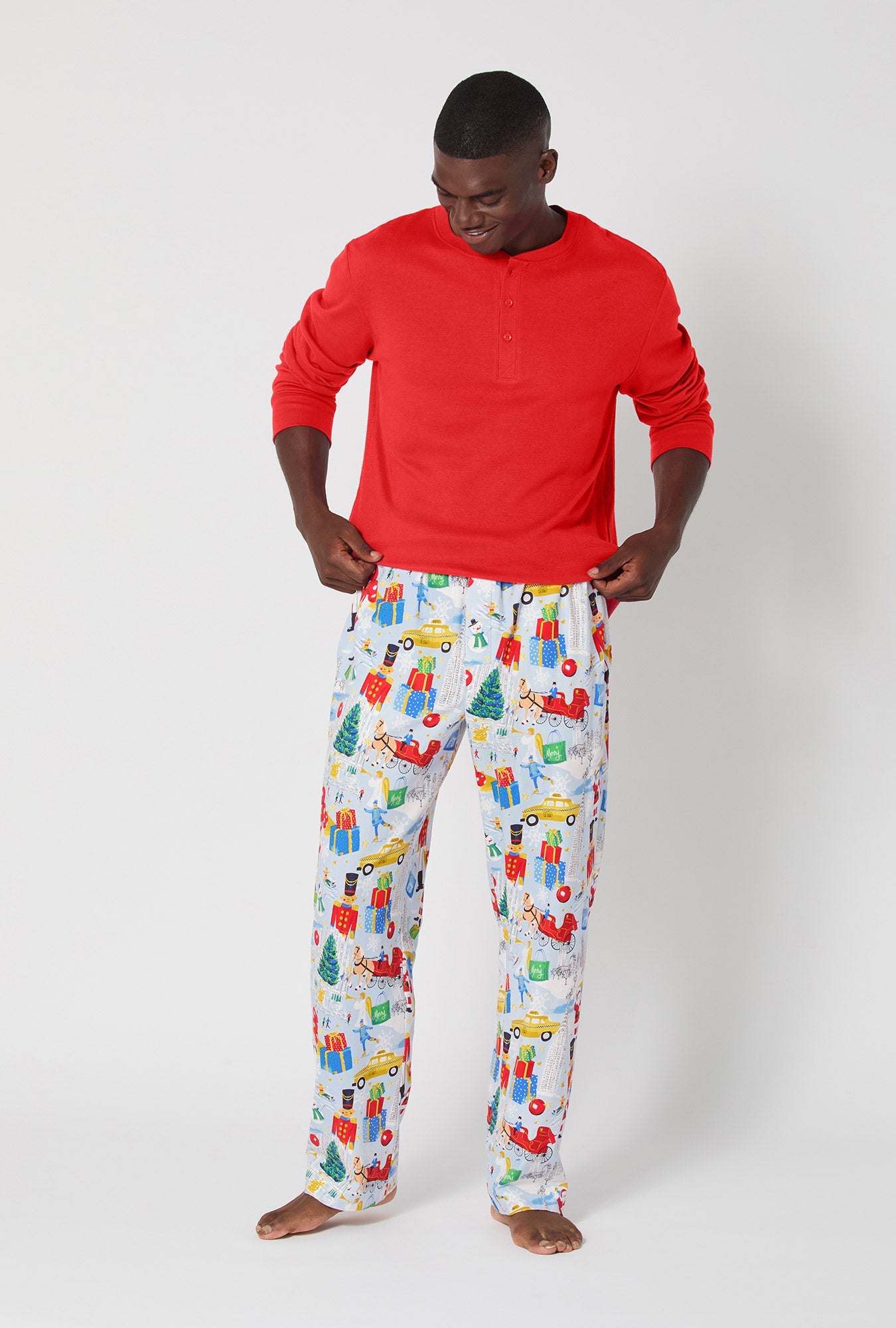 A man wearing A City Christmas Men's Long Sleeve Henley Stretch Jersey Pj Set