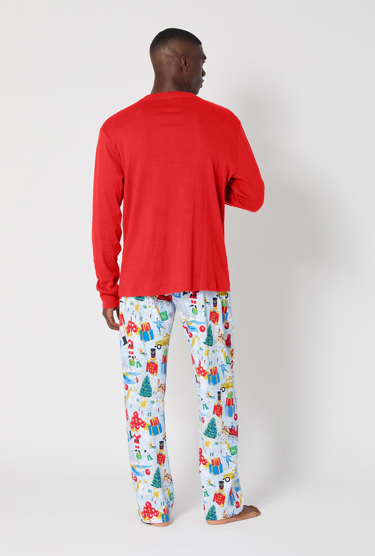 A man wearing A City Christmas Men&#39;s Long Sleeve Henley Stretch Jersey Pj Set