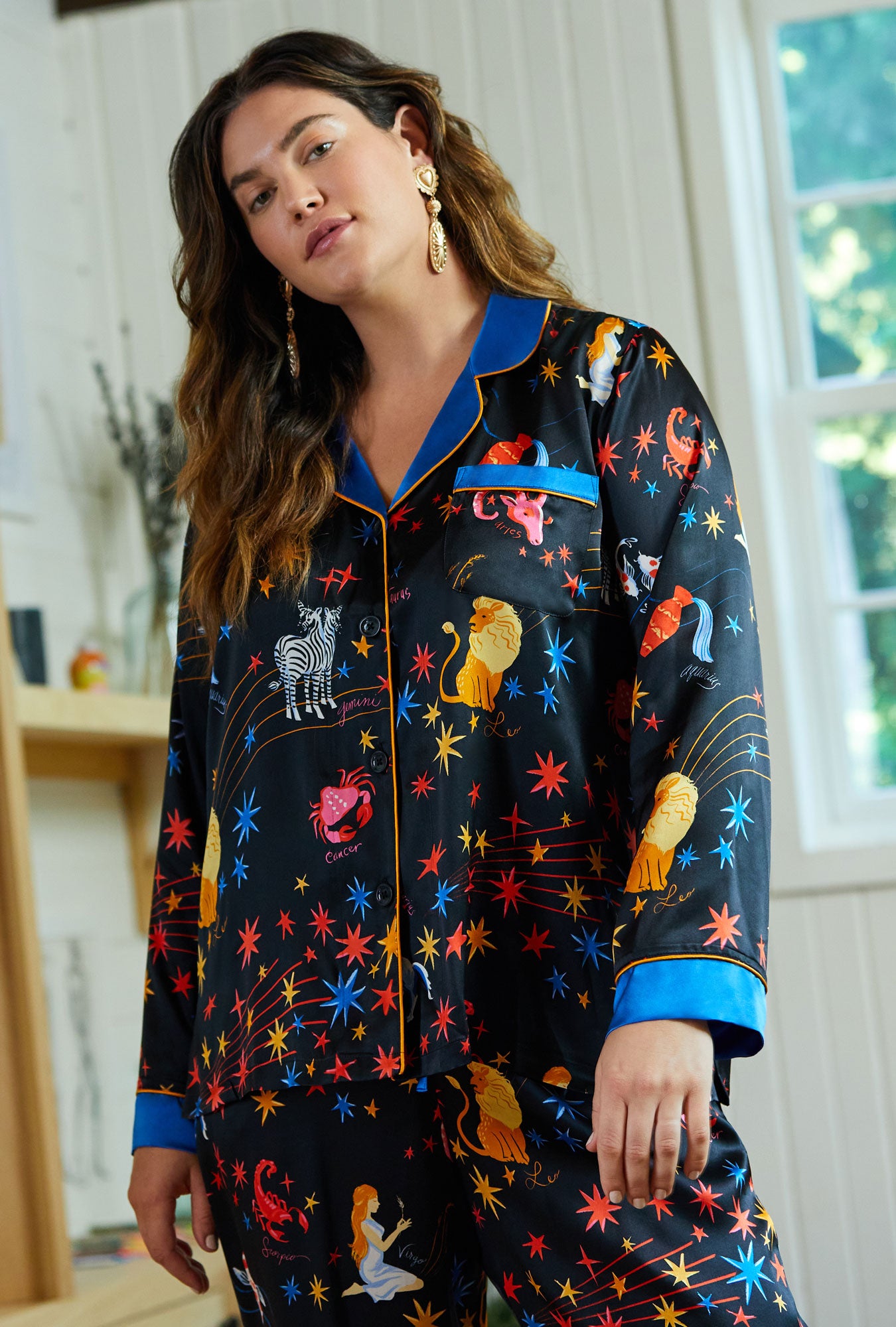 A lady wearing black Long Sleeve Classic Washable Silk PJ Set with Celestial Dreams print