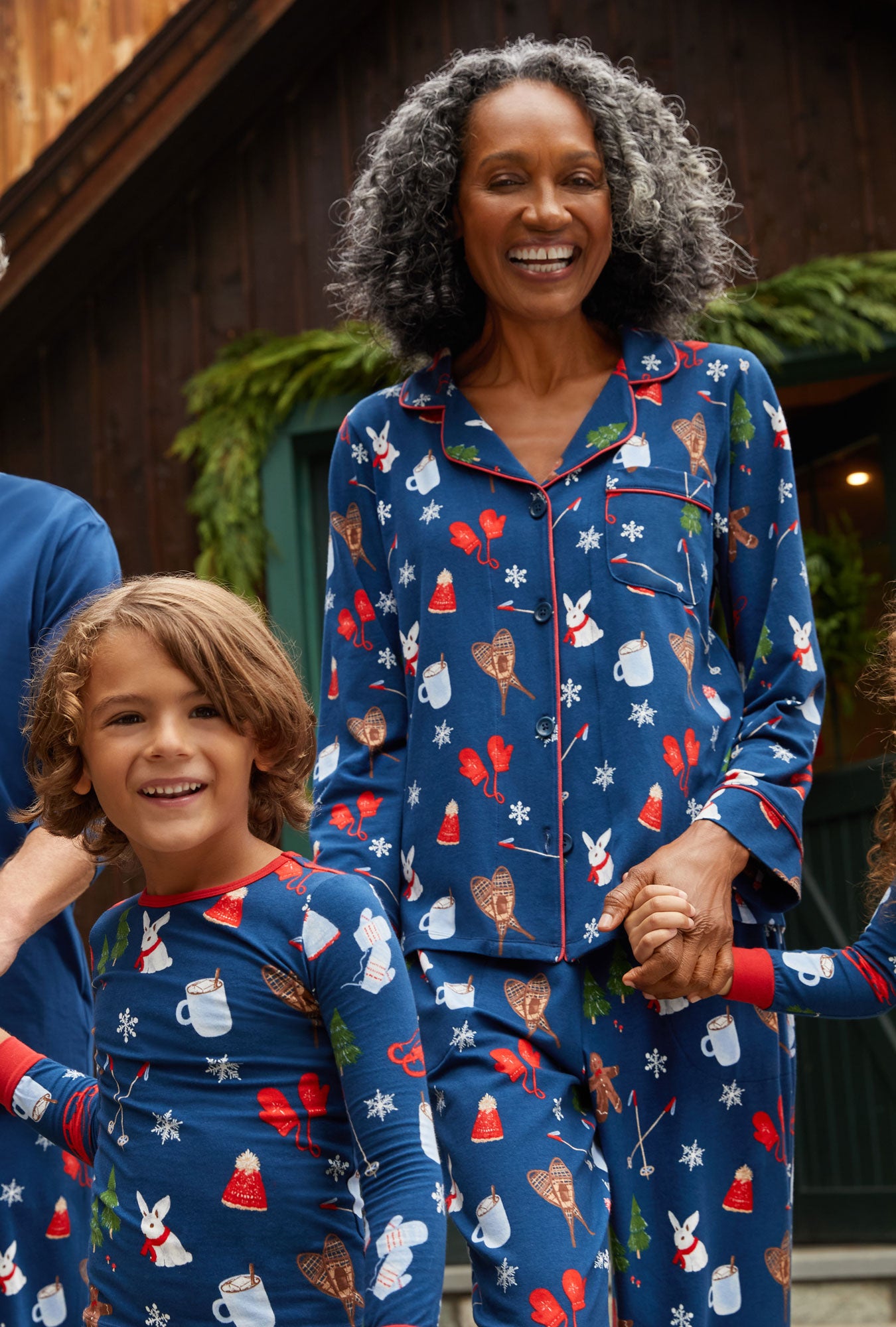 A lady wearing navy long sleeve classic stretch jersey pj set with seasonal delights print.