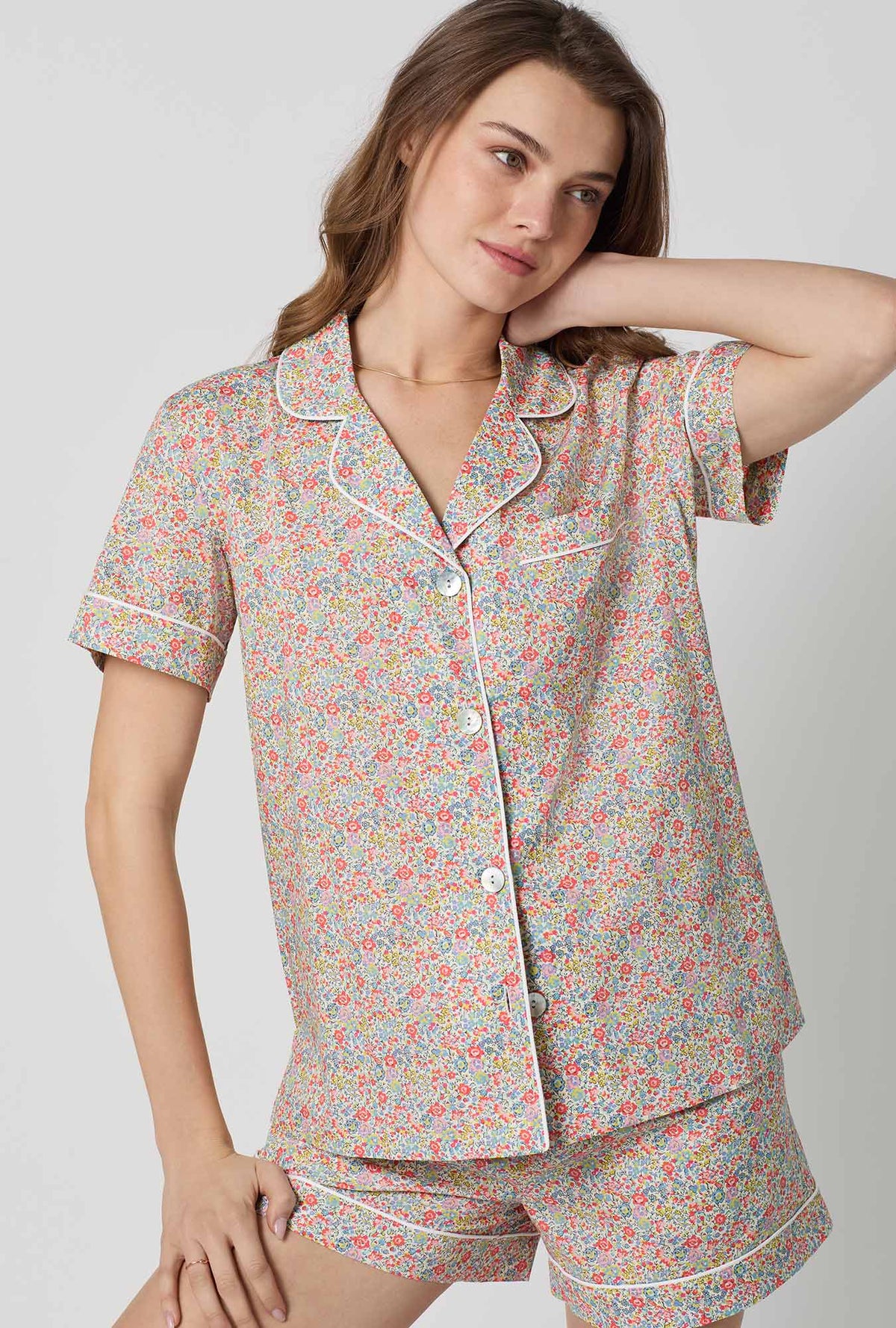 A closeup of A lady wearing Emma & Georgina Short Sleeve Classic Shorty Woven Tana Lawn® PJ Set Made with Liberty Fabric
