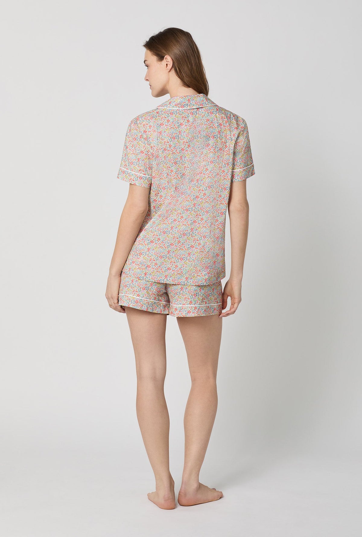 A lady wearing Emma & Georgina Short Sleeve Classic Shorty Woven Tana Lawn® PJ Set Made with Liberty Fabric back view