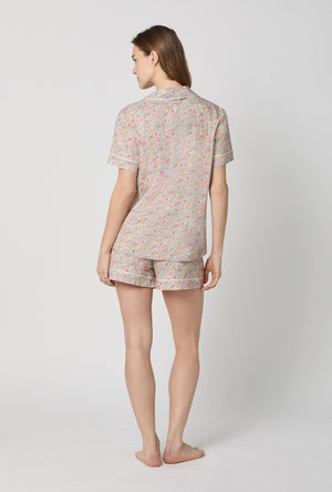 A lady wearing Emma & Georgina Short Sleeve Classic Shorty Woven Tana Lawn® PJ Set Made with Liberty Fabric back view