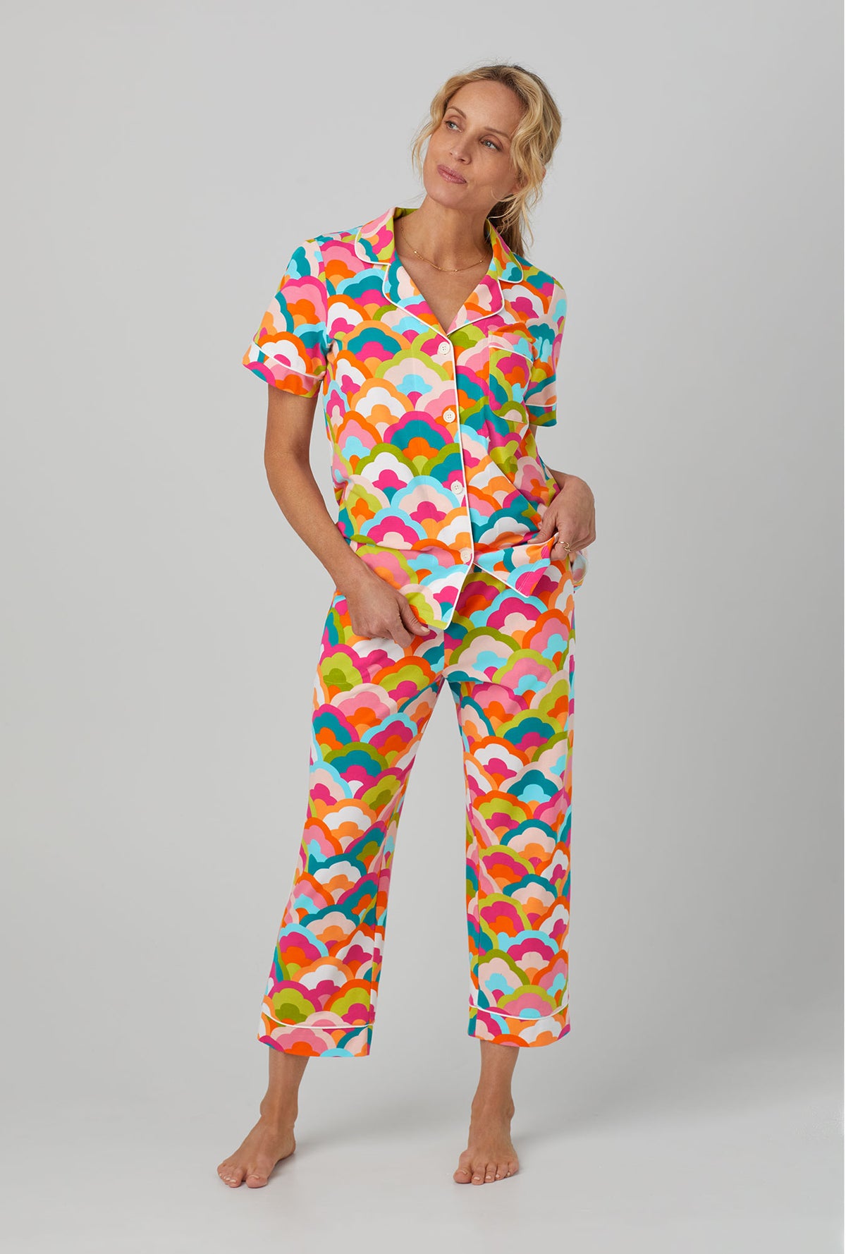 A lady wearing Short Sleeve Classic Stretch Jersey Cropped PJ Set with Rainbow Cloud print