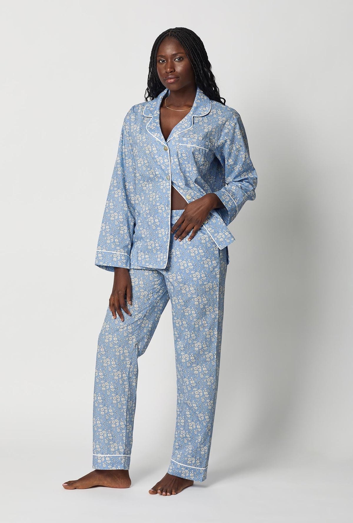 A lady wearing Blue Long Sleeve Classic Woven Tana Lawn® Pj Set Made With Liberty Fabric front view